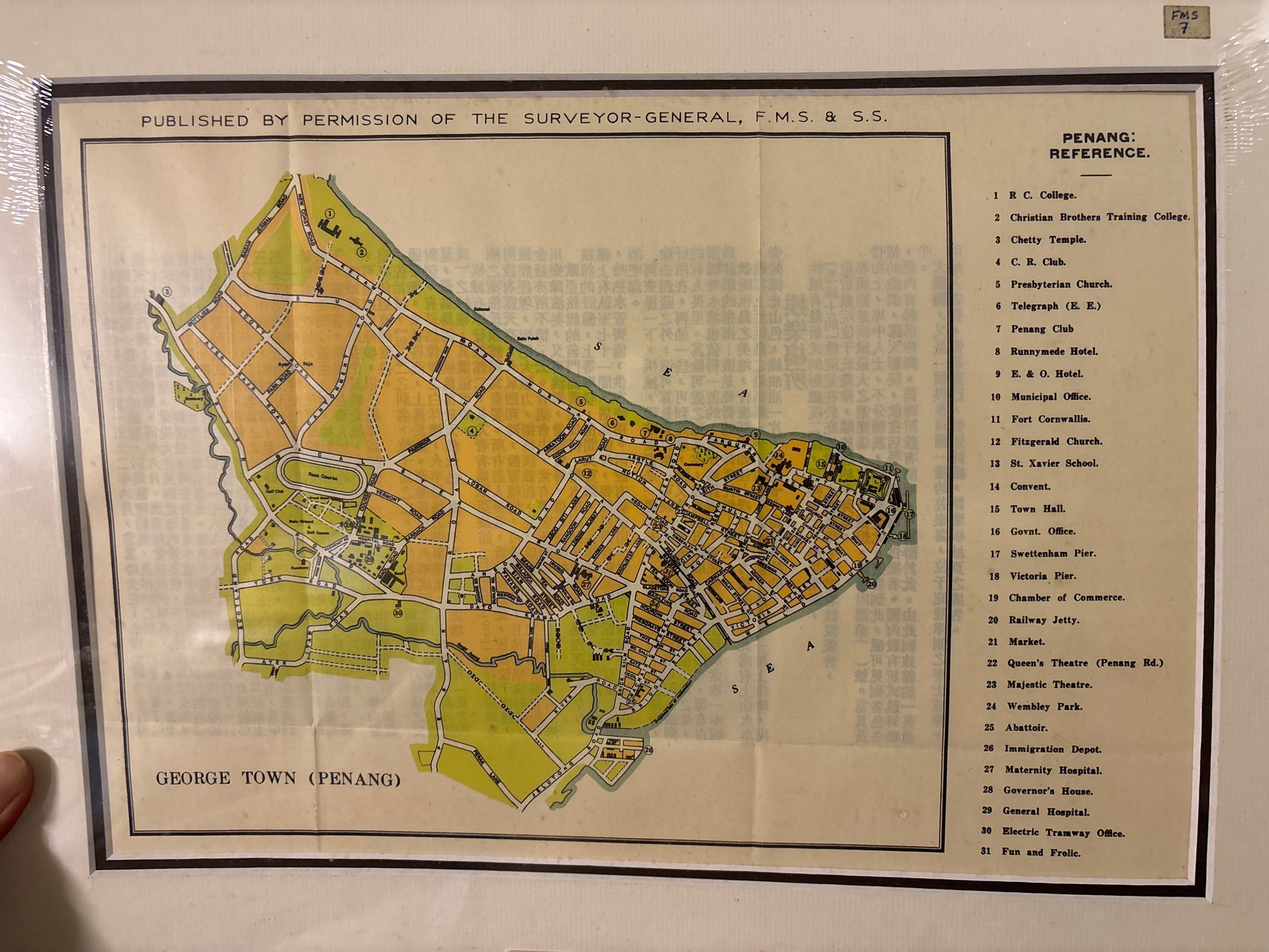 Vintage map of George Town, Penang with text and labels on a white background