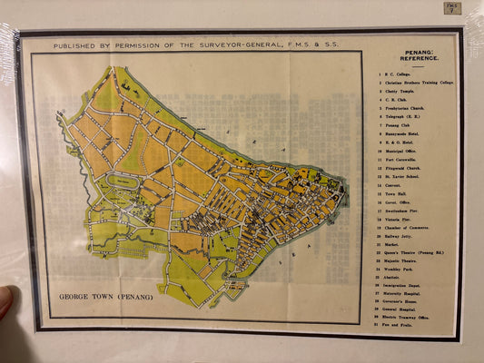 Vintage map of George Town, Penang with text and labels on a white background