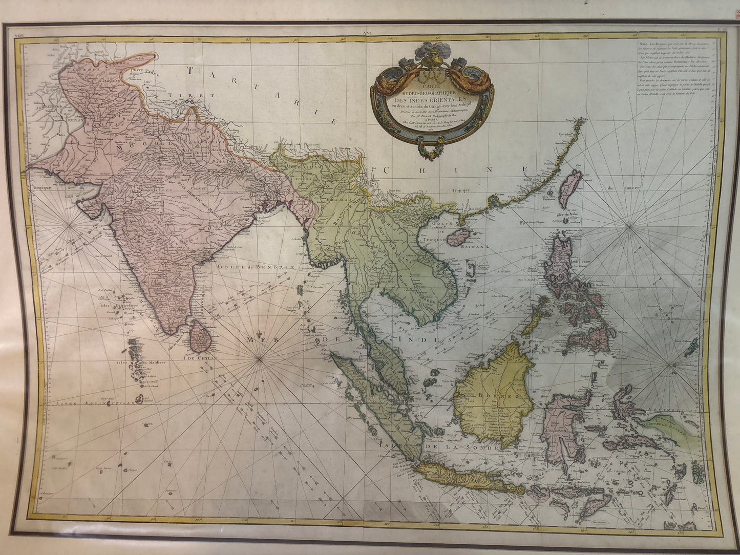 Vintage map of Asia and surrounding regions with decorative elements.