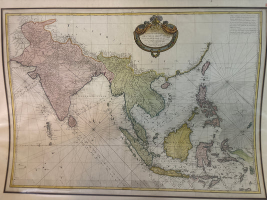 Vintage map of Asia and surrounding regions with decorative elements.